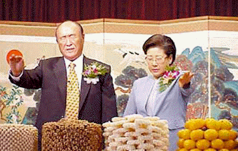 Father and Mother pray at the altar
